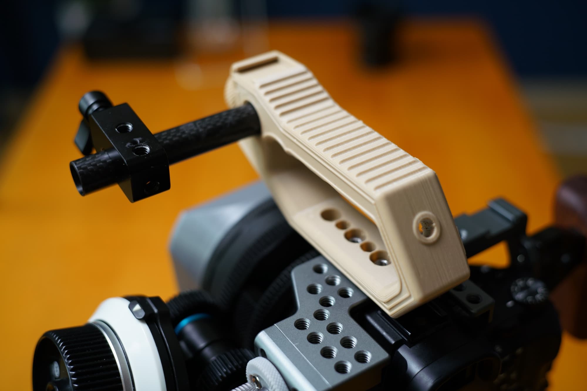 Camera top handle grip mounted on a cinema camera rig